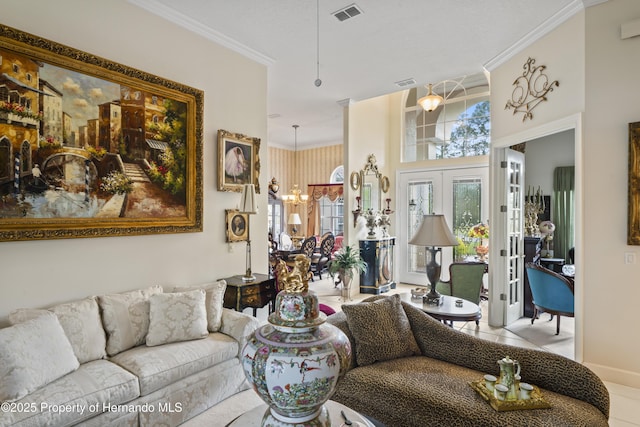 tiled living room featuring ornamental molding and french doors