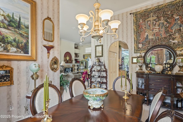 dining space featuring an inviting chandelier and ornamental molding