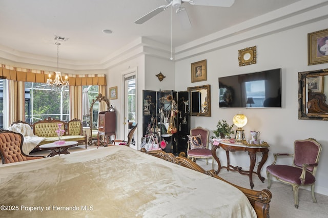 carpeted bedroom featuring a raised ceiling and ceiling fan with notable chandelier