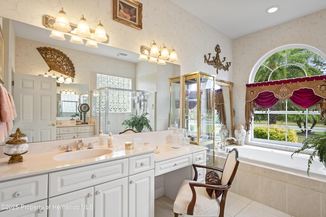 bathroom with vanity, tile patterned floors, independent shower and bath, and plenty of natural light