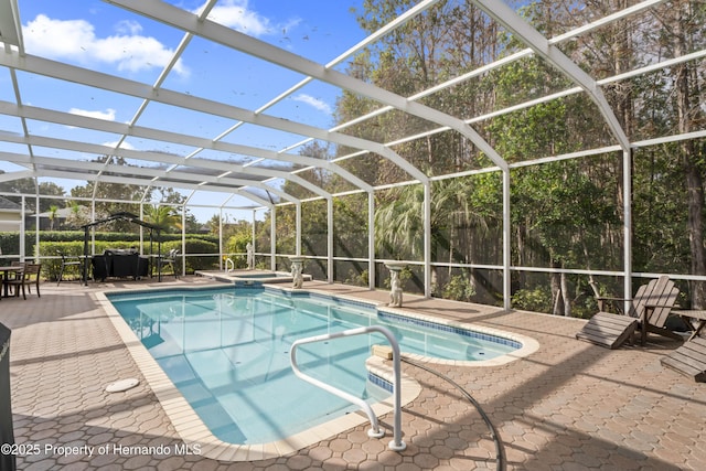 view of pool featuring a lanai and a patio area