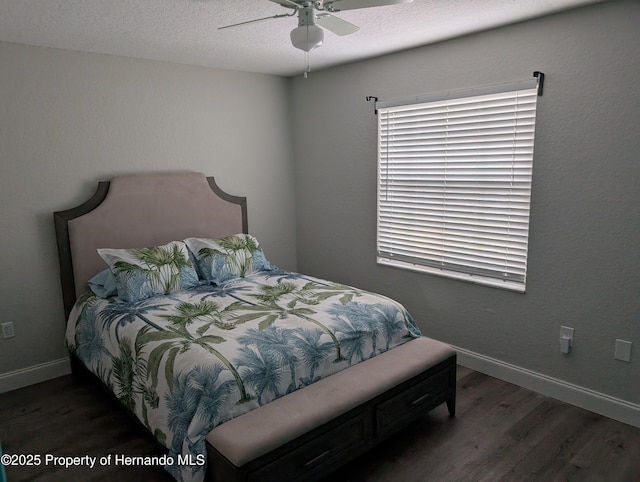 bedroom featuring ceiling fan and dark hardwood / wood-style flooring