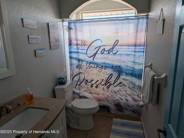 full bathroom featuring shower / tub combo with curtain, vanity, toilet, and tile patterned flooring