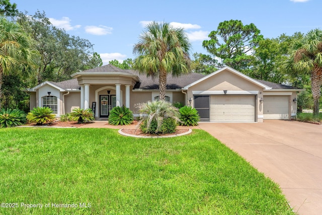 view of front facade with a garage and a front yard