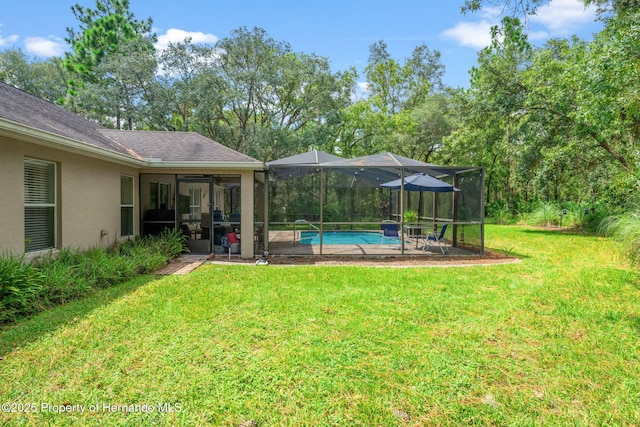 view of yard with a lanai