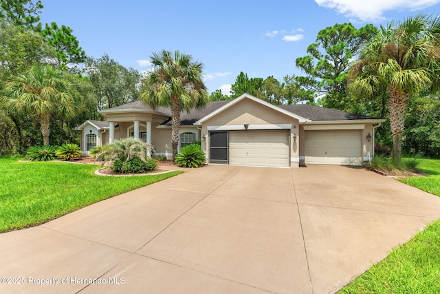 view of front of property with a garage and a front lawn