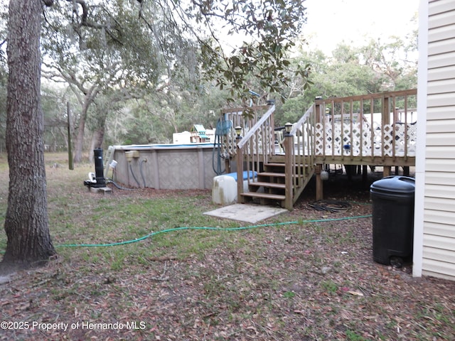 view of yard featuring a pool side deck