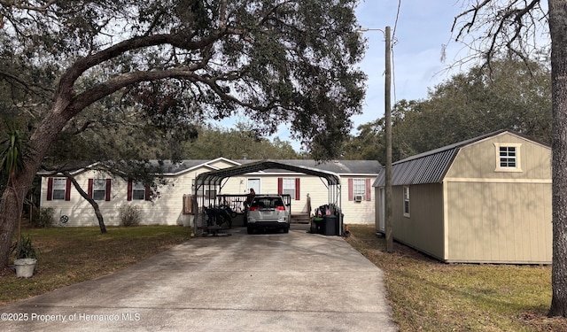 view of side of home featuring a carport, a lawn, and a storage shed