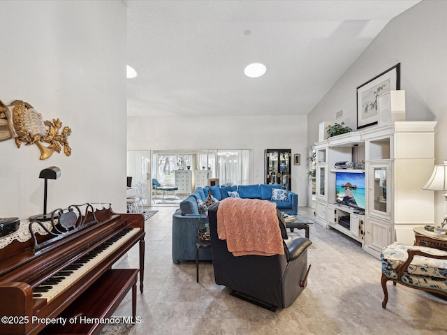 tiled living room with high vaulted ceiling