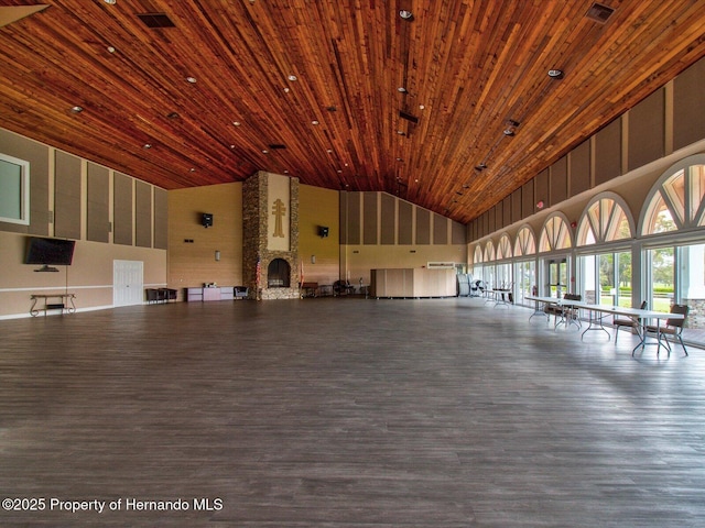 interior space featuring wood-type flooring, wood ceiling, and high vaulted ceiling