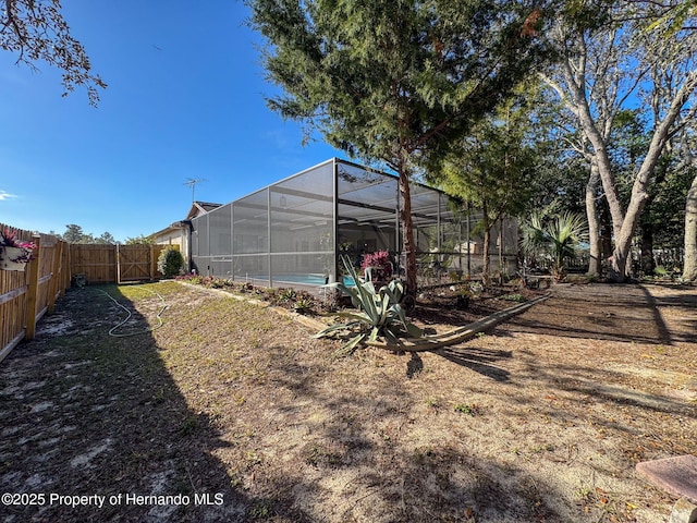 view of yard with a lanai