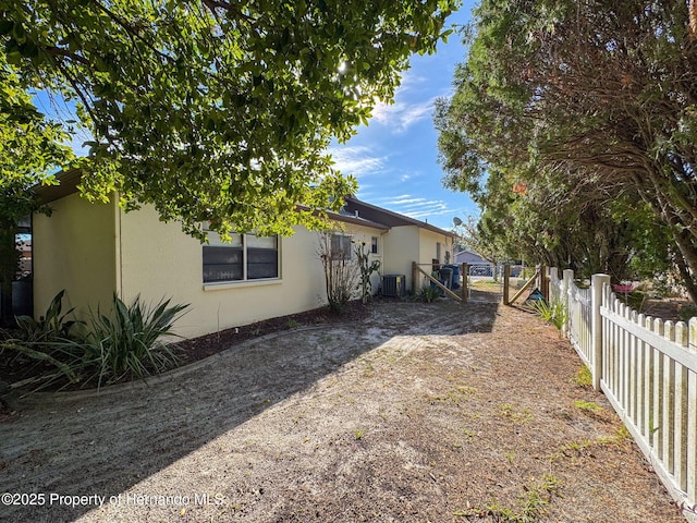 view of side of property featuring central AC unit