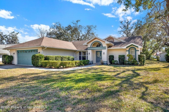 ranch-style home featuring a garage and a front lawn