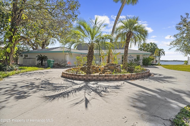 single story home featuring a water view