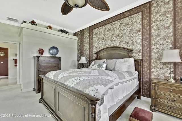 bedroom with ceiling fan, light colored carpet, and ornamental molding