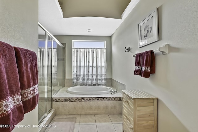 bathroom featuring tile patterned flooring and plus walk in shower