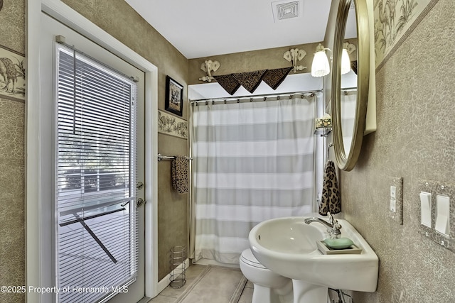 bathroom with sink and toilet