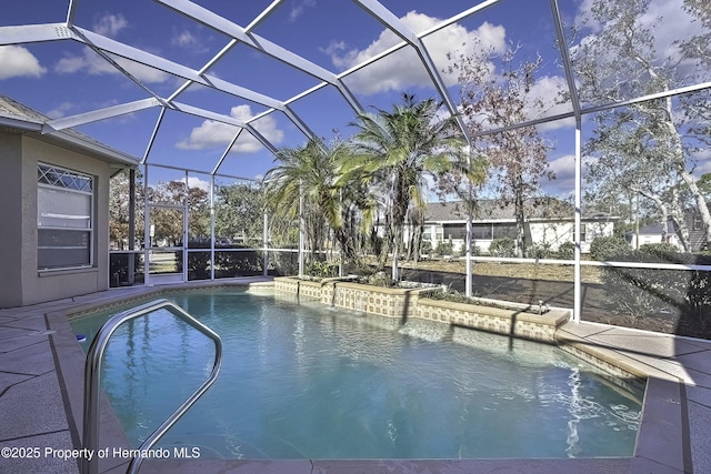 view of swimming pool with a lanai