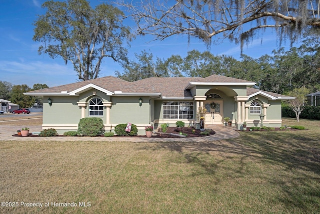 single story home with a front yard