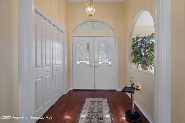 foyer entrance featuring dark hardwood / wood-style floors