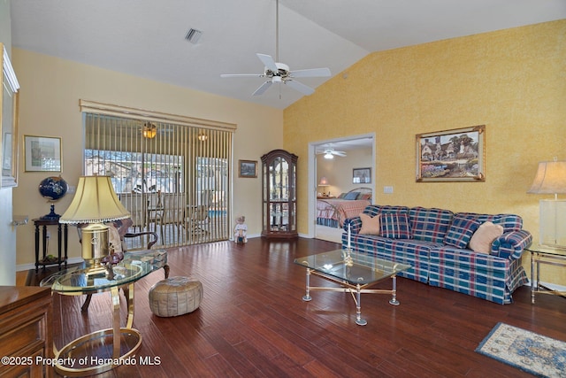 living room featuring high vaulted ceiling, dark hardwood / wood-style floors, and ceiling fan