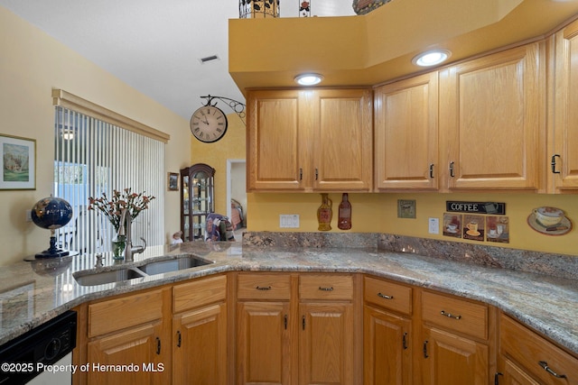 kitchen with dishwasher, light stone countertops, sink, and kitchen peninsula