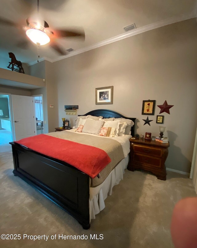 bedroom featuring crown molding, carpet floors, and ceiling fan