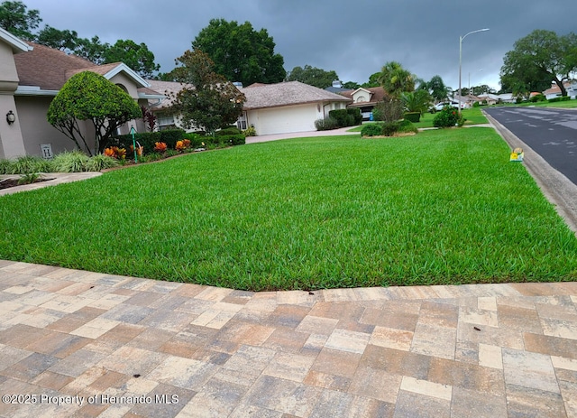 view of yard featuring a garage