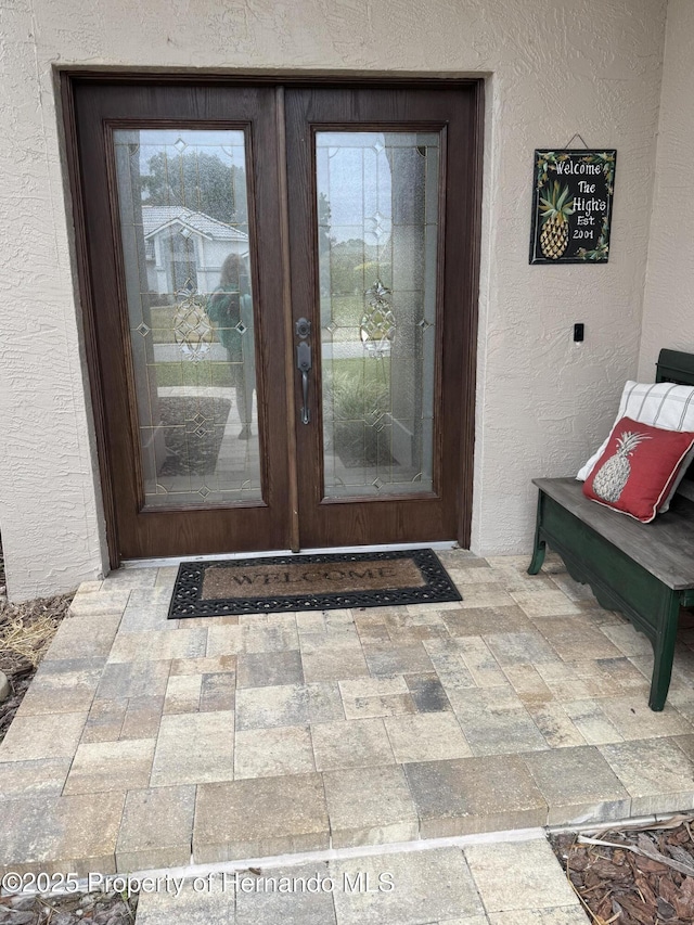 doorway to property featuring french doors