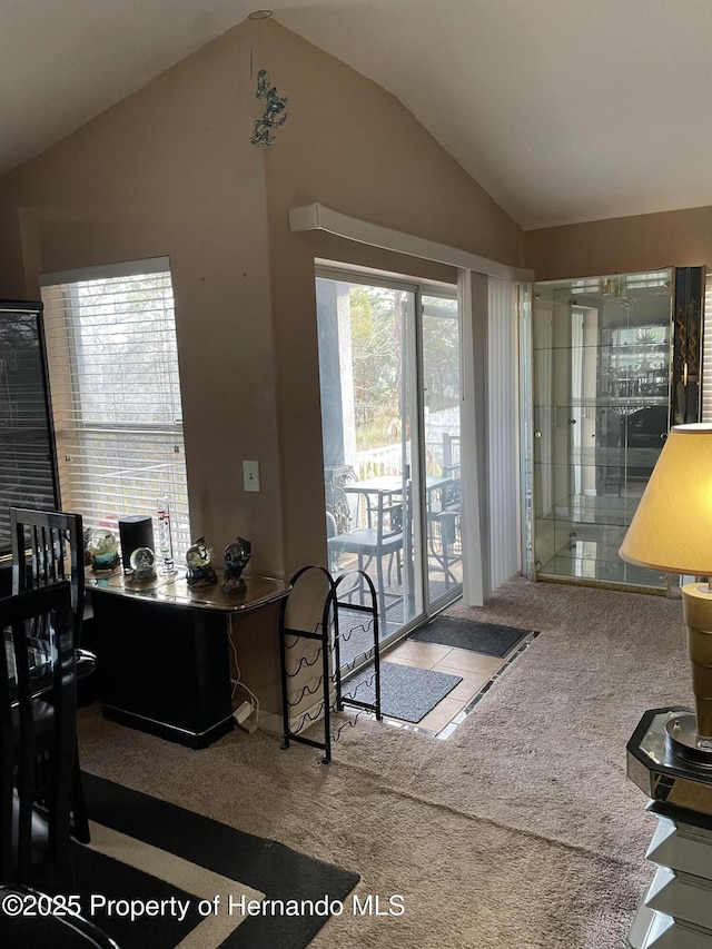 home office featuring carpet floors and lofted ceiling