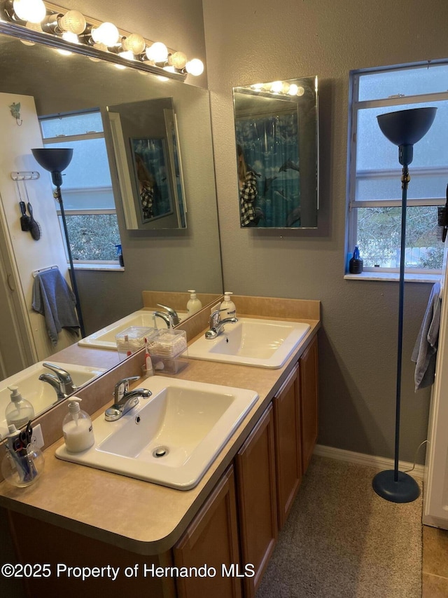 bathroom featuring tile patterned floors and vanity