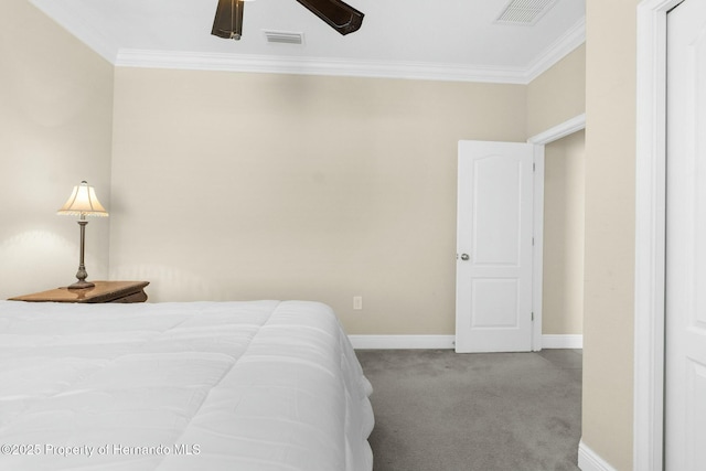 bedroom with baseboards, carpet, visible vents, and crown molding