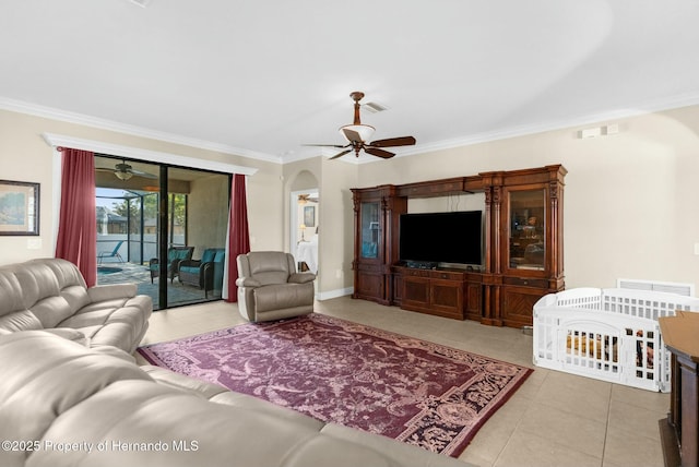 living area featuring ceiling fan, ornamental molding, light tile patterned floors, and visible vents