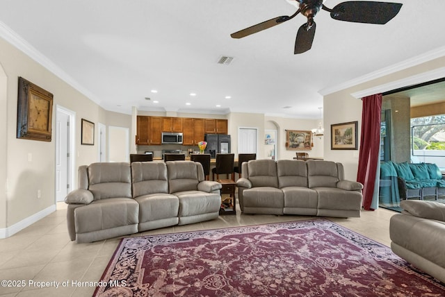 living area featuring light tile patterned flooring, baseboards, visible vents, and ornamental molding