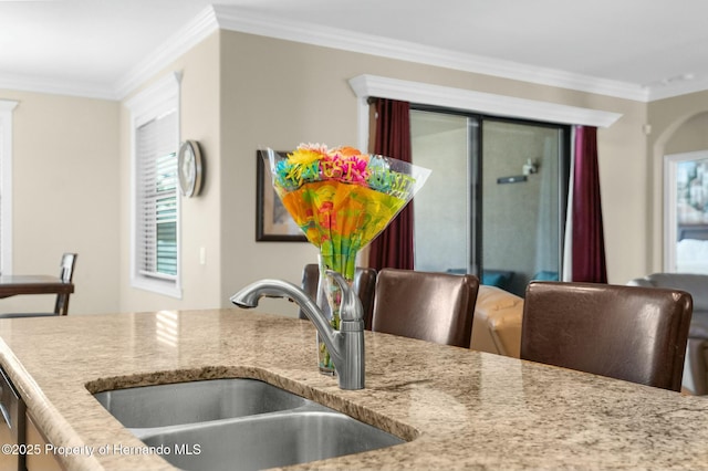 dining space featuring crown molding