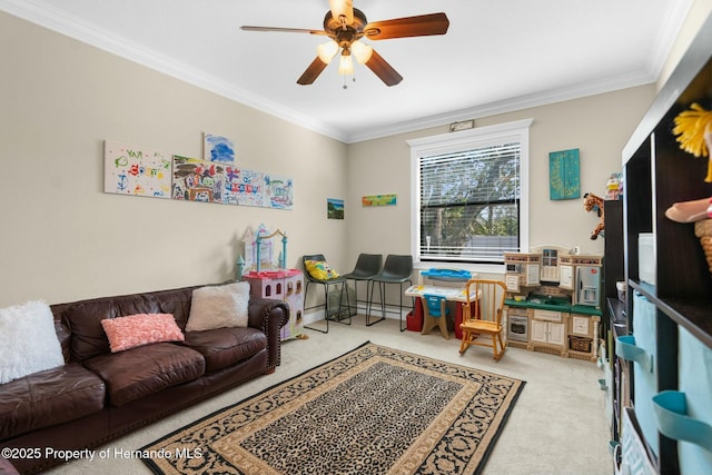 living area with ceiling fan, crown molding, and light colored carpet