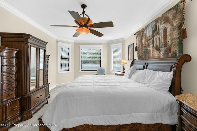 bedroom featuring ornamental molding, light colored carpet, ceiling fan, and baseboards