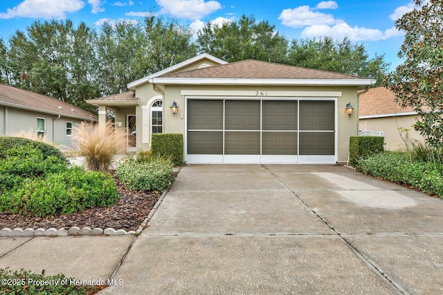 ranch-style home featuring a garage