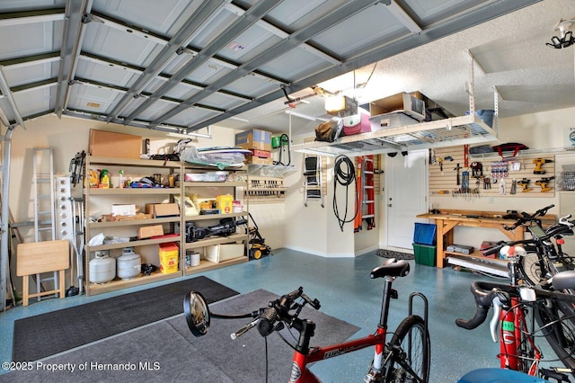 interior space with a workshop area and a textured ceiling