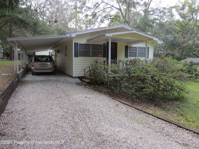 view of front of home with a carport