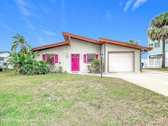 ranch-style house with a front yard and a garage