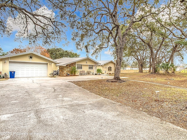 ranch-style home with a garage