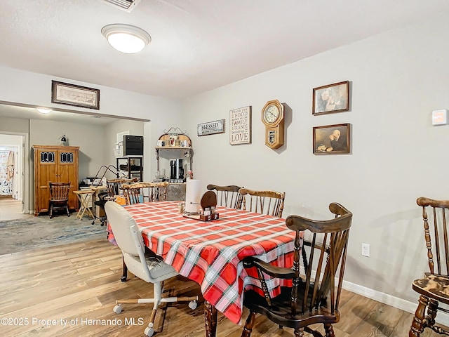 dining room featuring hardwood / wood-style flooring