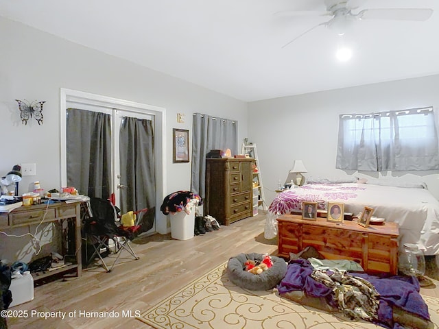 bedroom featuring ceiling fan and light hardwood / wood-style flooring