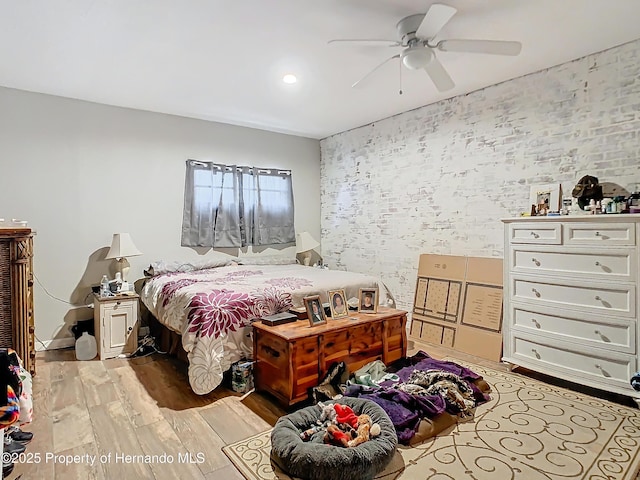 bedroom featuring light wood-type flooring and ceiling fan