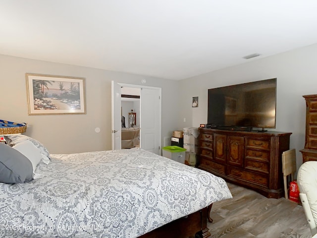 bedroom with light hardwood / wood-style floors