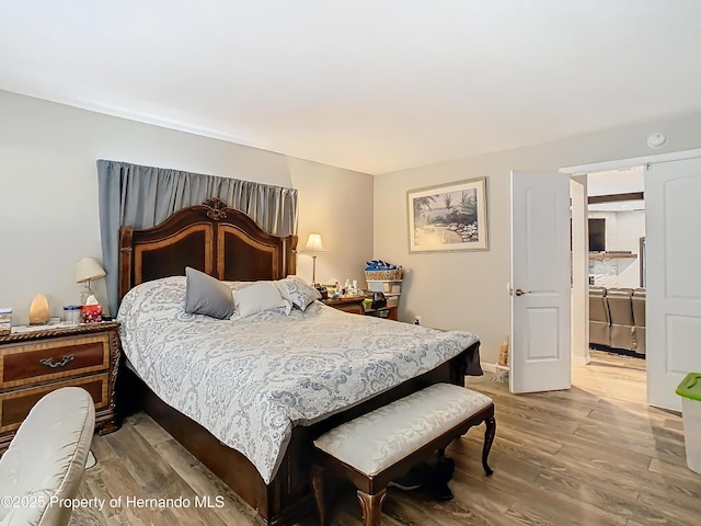 bedroom featuring light wood-type flooring