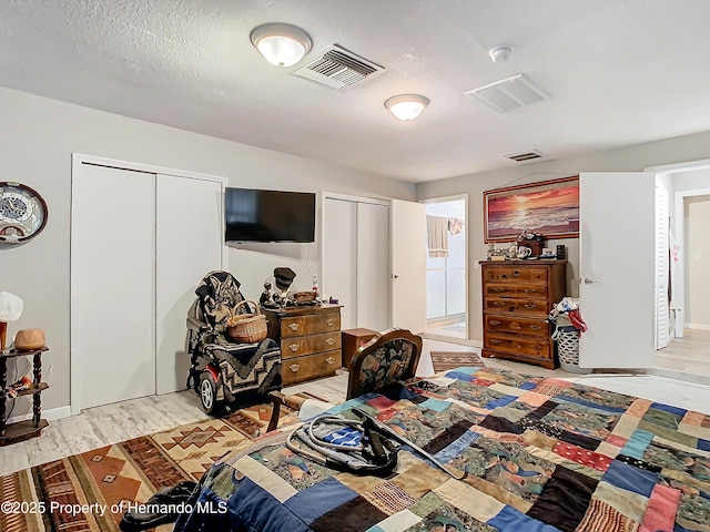 bedroom with light hardwood / wood-style flooring