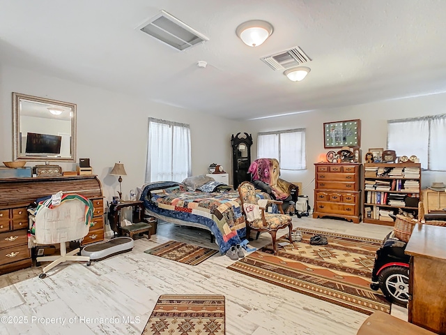 bedroom with light wood-type flooring