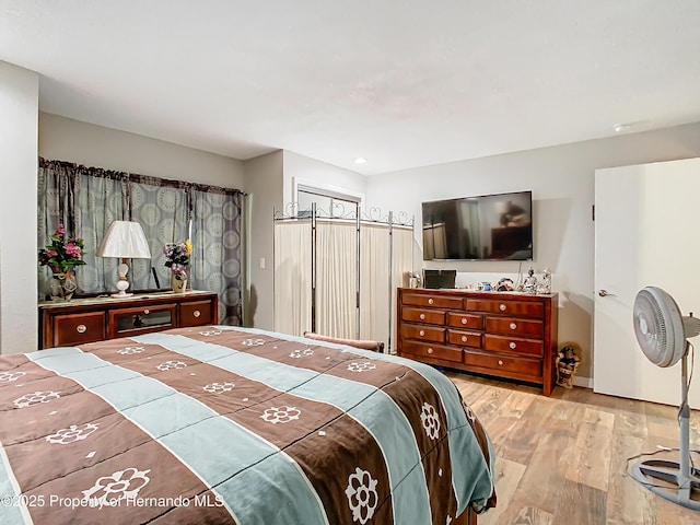 bedroom with light hardwood / wood-style flooring